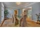 Bright dining room with decorative chandelier, hardwood floors and entry to other rooms at 181 Sentinel Pl, Marietta, GA 30067