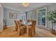 Formal dining room with natural light, hardwood floors, and views of the backyard at 181 Sentinel Pl, Marietta, GA 30067
