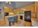 Well-equipped kitchen with hardwood floors, center island, and black appliances, offering a modern and functional design at 181 Sentinel Pl, Marietta, GA 30067