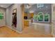 Open kitchen and dining area with hardwood floors, skylight, and large picture window at 181 Sentinel Pl, Marietta, GA 30067