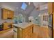 Spacious kitchen with hardwood floors, an island with sink, and built-in appliances, perfect for culinary creations at 181 Sentinel Pl, Marietta, GA 30067