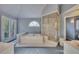 Bathroom suite with soaker tub, shower, French doors, and sunlight at 181 Sentinel Pl, Marietta, GA 30067