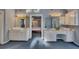 Dual vanity sinks with ample storage and decorative fixtures in bathroom suite at 181 Sentinel Pl, Marietta, GA 30067