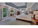 Large main bedroom with fireplace, tray ceiling, and access to private balcony at 181 Sentinel Pl, Marietta, GA 30067