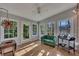 Cozy sunroom with hardwood floors, large windows, and a ceiling fan at 181 Sentinel Pl, Marietta, GA 30067