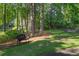 A bench seat located on a corner of the lot next to the side-walk at 181 Sentinel Pl, Marietta, GA 30067