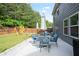 Enjoy a great patio space in this backyard, complete with dining and lounge seating with a playground at 2210 Valley Creek Dr, Lithia Springs, GA 30122
