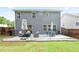 Backyard with a patio set with green grass and a partial fence at 2210 Valley Creek Dr, Lithia Springs, GA 30122