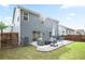 Backyard featuring a patio with outdoor seating, a well-manicured lawn, and privacy fencing at 2210 Valley Creek Dr, Lithia Springs, GA 30122