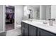 Bathroom with double sinks, walk-in closet, and stand up shower at 2210 Valley Creek Dr, Lithia Springs, GA 30122