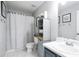 Well-lit bathroom featuring modern fixtures, built-in shelving, and a shower curtain at 2210 Valley Creek Dr, Lithia Springs, GA 30122