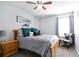 Cozy bedroom with plush bed, wood furniture, and a patterned armchair at 2210 Valley Creek Dr, Lithia Springs, GA 30122