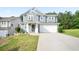 Inviting two-story home with a well-maintained lawn, a two-car garage, and classic curb appeal at 2210 Valley Creek Dr, Lithia Springs, GA 30122