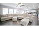 Bright and open-concept living room with large sectional sofa and modern finishes at 2210 Valley Creek Dr, Lithia Springs, GA 30122