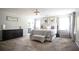 Spacious primary bedroom with plush carpet, neutral decor, and ample natural light at 2210 Valley Creek Dr, Lithia Springs, GA 30122