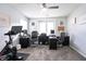 Bright home office features two workstations, ceiling fan, and neutral decor at 2210 Valley Creek Dr, Lithia Springs, GA 30122