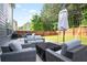 Relaxing patio featuring comfortable wicker furniture, great for entertaining in the backyard at 2210 Valley Creek Dr, Lithia Springs, GA 30122