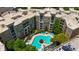 Aerial view of a residential complex with a pool, greenery, and parking at 390 17Th Nw St # 6036, Atlanta, GA 30363