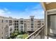 Relaxing balcony view showcasing complex pool, trees, and building architecture at 390 17Th Nw St # 6036, Atlanta, GA 30363