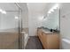 Bathroom featuring a glass shower enclosure and granite vanity with double sinks at 390 17Th Nw St # 6036, Atlanta, GA 30363