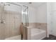 Bathroom featuring a glass shower enclosure and a separate soaking tub at 390 17Th Nw St # 6036, Atlanta, GA 30363