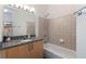 Bright bathroom with a granite countertop, modern fixtures, and neutral walls at 390 17Th Nw St # 6036, Atlanta, GA 30363