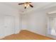 Bedroom featuring a ceiling fan, laminate floors, and private balcony access at 390 17Th Nw St # 6036, Atlanta, GA 30363