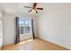 Bright bedroom featuring a ceiling fan, natural light, and attractive laminate flooring at 390 17Th Nw St # 6036, Atlanta, GA 30363