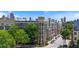 Apartment complex in an urban setting features mature trees and a view of the city skyline at 390 17Th Nw St # 6036, Atlanta, GA 30363