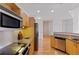 Contemporary kitchen features stainless steel appliances, a cooktop, and granite countertops at 390 17Th Nw St # 6036, Atlanta, GA 30363