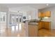 Open-concept kitchen flows seamlessly into the living area with a breakfast bar and modern lighting at 390 17Th Nw St # 6036, Atlanta, GA 30363