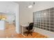 Bright office space with modern desk, chair, and unique glass block window at 390 17Th Nw St # 6036, Atlanta, GA 30363
