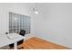 Home office with glass block window and desk with room for chair at 390 17Th Nw St # 6036, Atlanta, GA 30363