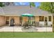 Expansive backyard patio with outdoor seating and a view of the lush green lawn at 5850 Shannon Dr, Cumming, GA 30040
