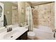 Tiled bathroom featuring a tub/shower combo and vanity at 5850 Shannon Dr, Cumming, GA 30040