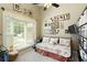 Cozy bedroom featuring a daybed, bay window, and custom shelving at 5850 Shannon Dr, Cumming, GA 30040