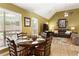Dining area with hardwood floors, natural light, and comfortable seating at 5850 Shannon Dr, Cumming, GA 30040