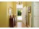 Inviting foyer with chandelier, high ceilings and wood-look flooring, providing a warm welcome at 5850 Shannon Dr, Cumming, GA 30040