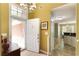 Bright foyer featuring tile flooring, a chandelier and views into other living spaces at 5850 Shannon Dr, Cumming, GA 30040