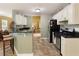 Cozy kitchen features granite countertops, stainless steel appliances, and bar seating at 5850 Shannon Dr, Cumming, GA 30040