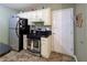 The kitchen features stainless steel appliances and white cabinets at 5850 Shannon Dr, Cumming, GA 30040