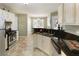 Spacious kitchen features granite countertops, stainless appliances, and a breakfast bar at 5850 Shannon Dr, Cumming, GA 30040