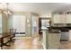 Inviting kitchen boasts granite countertops, ample counter space, and tiled flooring at 5850 Shannon Dr, Cumming, GA 30040