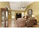 Cozy living room with vaulted ceiling, wood flooring, and comfortable seating area at 5850 Shannon Dr, Cumming, GA 30040
