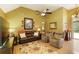 Inviting living room with vaulted ceiling, laminate flooring, and comfortable seating arrangement at 5850 Shannon Dr, Cumming, GA 30040