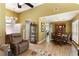 Inviting living room and dining area with hardwood floors and large windows offering natural light at 5850 Shannon Dr, Cumming, GA 30040