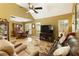 Comfortable living room with hardwood floors, vaulted ceiling, and large windows at 5850 Shannon Dr, Cumming, GA 30040