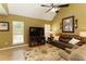 Comfortable living room with vaulted ceiling, wood flooring, and a cozy seating arrangement at 5850 Shannon Dr, Cumming, GA 30040