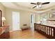 Light-filled main bedroom with wood floors, trey ceiling, and ensuite bathroom at 5850 Shannon Dr, Cumming, GA 30040