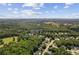 This aerial view displays the real estate and the surrounding trees and landscape in Hiram, Georgia at 84 Conner Glenn Dr, Hiram, GA 30141